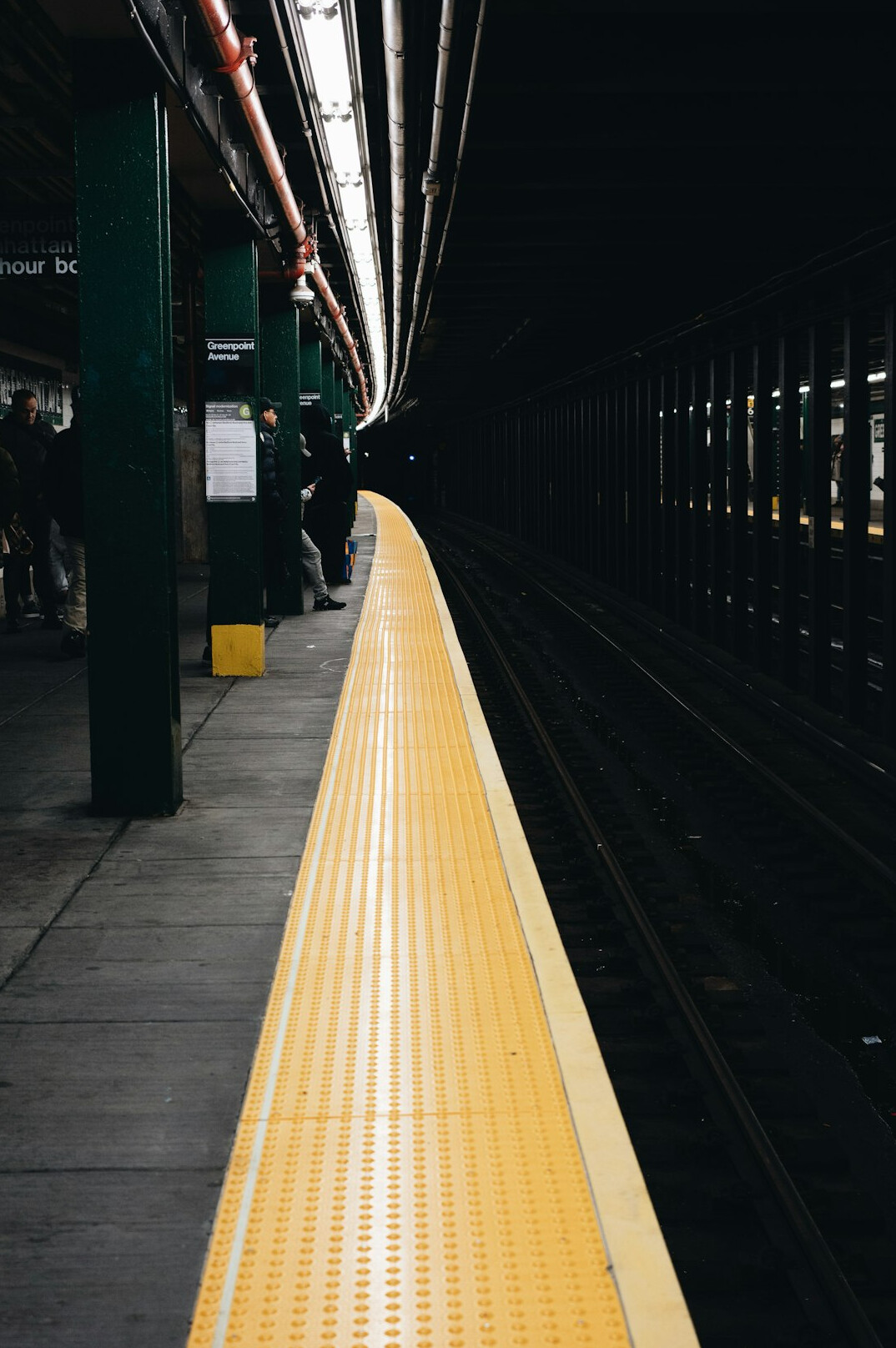 Commuters waiting on a subway platform