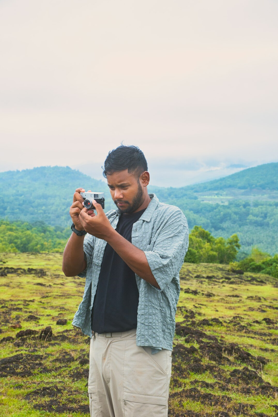 Portrait of a young man photographer of South Asian descent