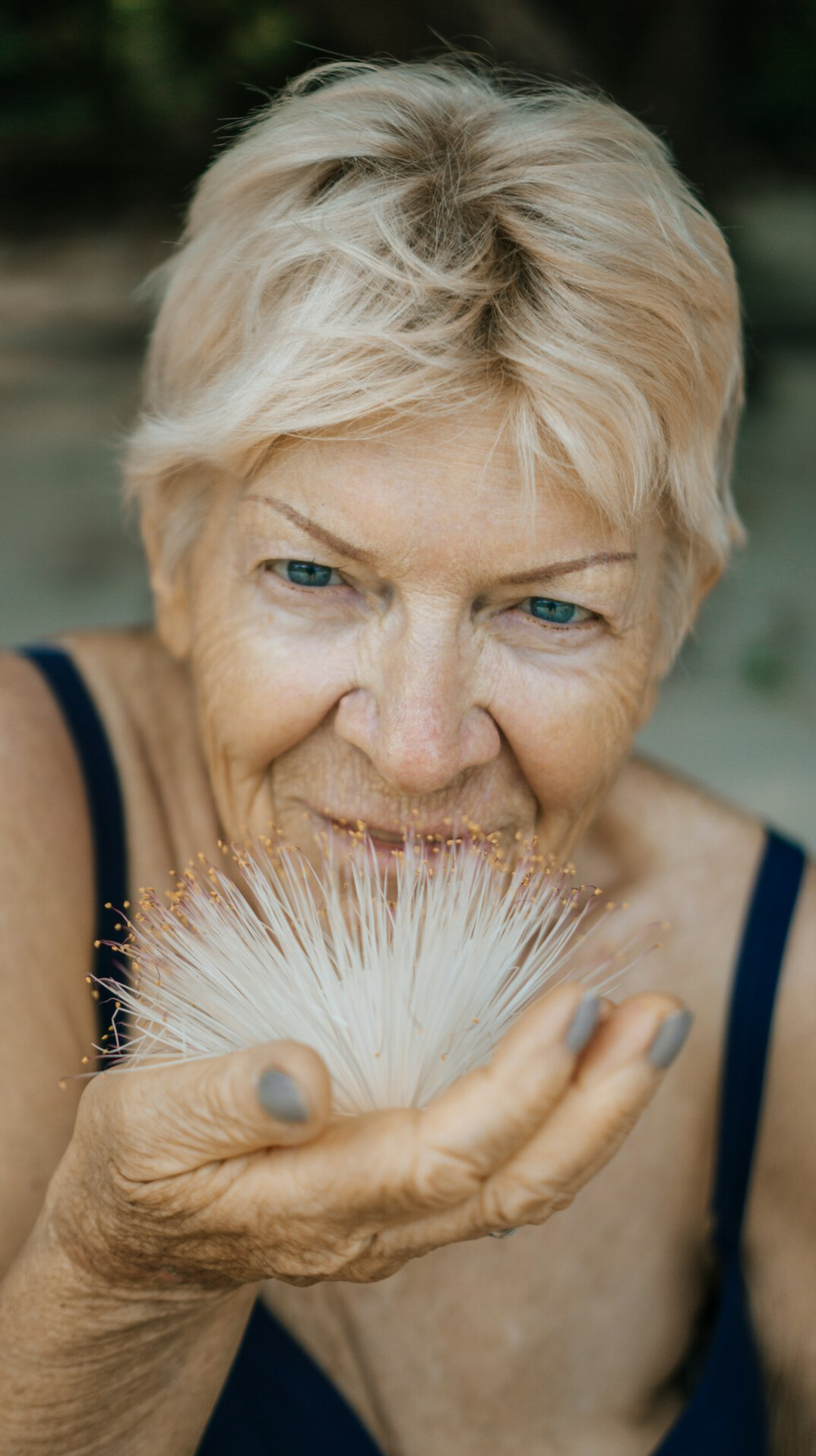 Portrait of a senior woman photographer with grey hair