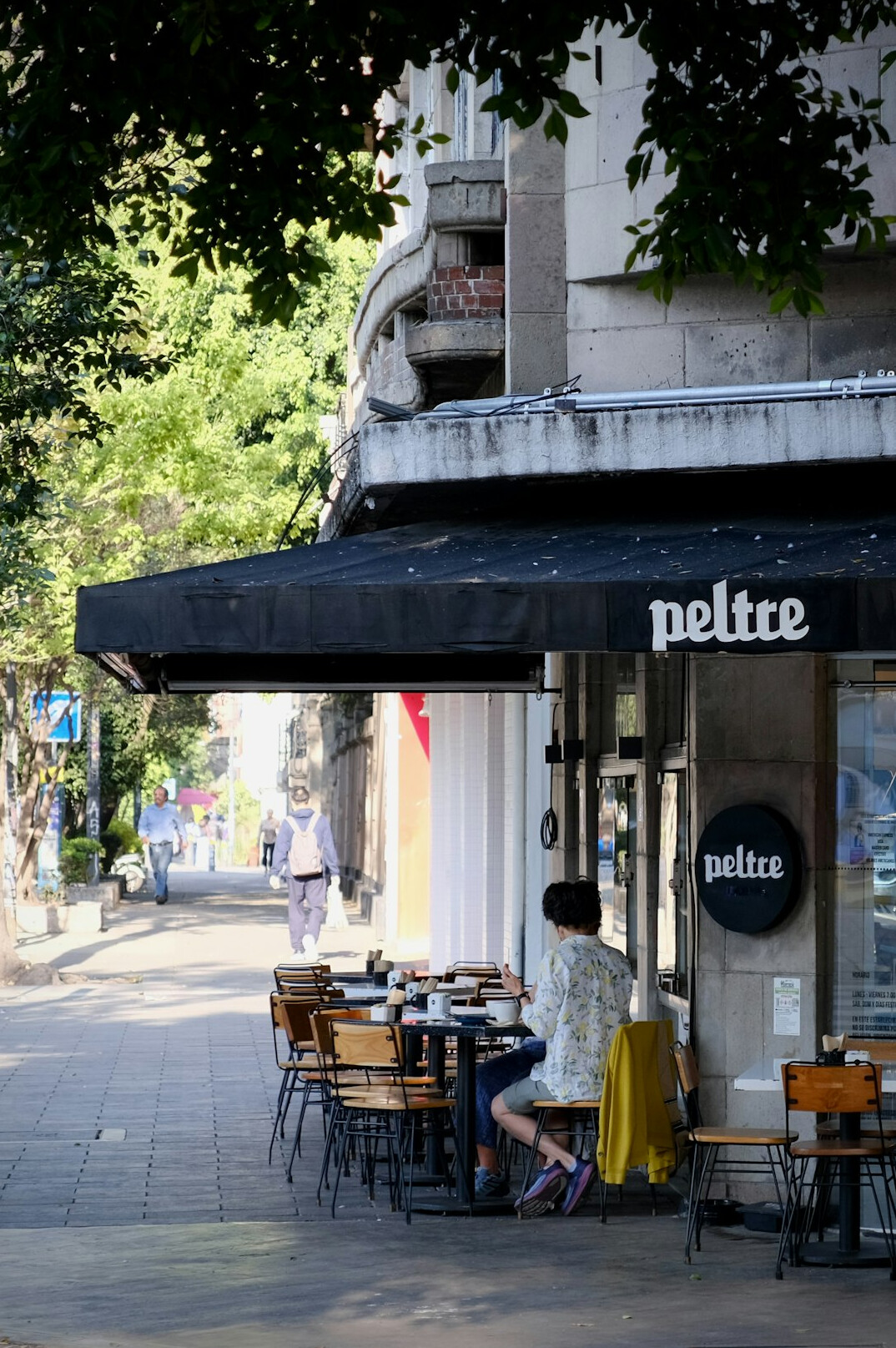 People sitting at an outdoor cafe terrace