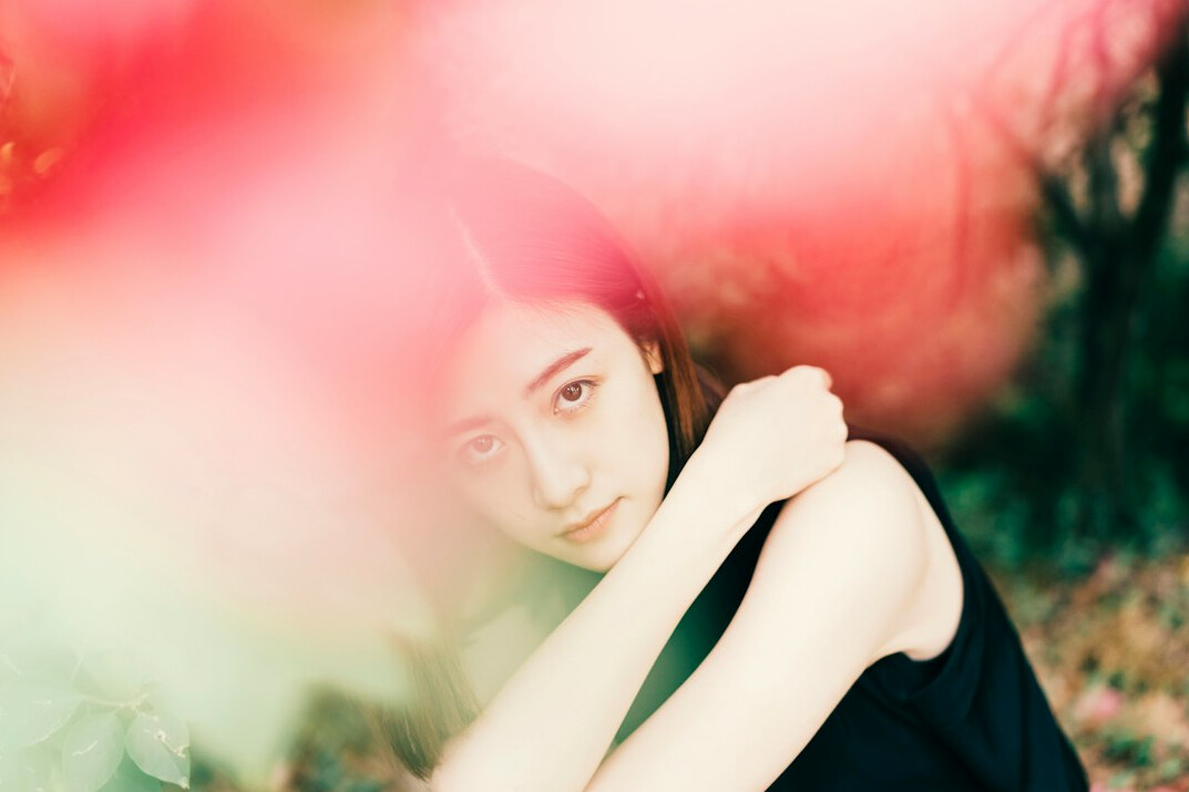 Portrait of a young East Asian woman photographer